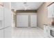 Spacious open kitchen with white appliances, granite counters, and tile floor at 13526 Norman Cir, Hudson, FL 34669
