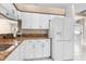 Bright kitchen with plenty of cabinet space, granite counters, and new appliances at 13526 Norman Cir, Hudson, FL 34669