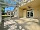 Large screened patio with tile floor, ceiling fan, and yard views, ideal for enjoying outdoor living and entertaining at 13526 Norman Cir, Hudson, FL 34669