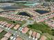 Community aerial view, showcasing the home's neighborhood, lakes and nearby town center at 17152 Scuba Crest St, Wimauma, FL 33598