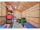Finished attic space with storage bins and shelving, providing organized storage solutions at 17152 Scuba Crest St, Wimauma, FL 33598