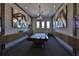 Community billiard room featuring a high-end pool table, stylish lighting, and TV at 17152 Scuba Crest St, Wimauma, FL 33598