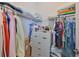 Walk-in closet with ample hanging space, shelving, and drawers for organized storage solutions at 17152 Scuba Crest St, Wimauma, FL 33598