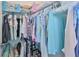 Efficient closet space with rods, shelving, and hangers, provides an organized storage solution for clothing and accessories at 17152 Scuba Crest St, Wimauma, FL 33598