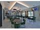 Elegant community dining area featuring stylish decor, comfortable seating, and plenty of natural light at 17152 Scuba Crest St, Wimauma, FL 33598