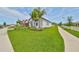 Well-maintained home with green lawn, sidewalk access, and beautiful curb appeal at 17152 Scuba Crest St, Wimauma, FL 33598