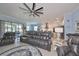 Open floor plan of living room, kitchen, stainless steel appliances and recessed lighting at 17152 Scuba Crest St, Wimauma, FL 33598