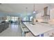 Spacious open living space with a large kitchen island and modern appliances at 17152 Scuba Crest St, Wimauma, FL 33598