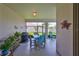 Cozy screened patio featuring a dining table, chairs, and a view of the backyard at 17152 Scuba Crest St, Wimauma, FL 33598
