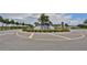 Beautiful water feature in the community roundabout, highlighted by colorful flowers and lush greenery at 17152 Scuba Crest St, Wimauma, FL 33598