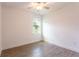 Cozy bedroom with tiled floors and a ceiling fan at 17406 Isaac Ln, Punta Gorda, FL 33955