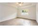 Bright and airy bedroom with a ceiling fan and tray ceiling at 17406 Isaac Ln, Punta Gorda, FL 33955