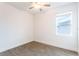 Cozy bedroom with tiled floors and a window at 17406 Isaac Ln, Punta Gorda, FL 33955