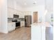 Modern kitchen features stainless steel appliances, a center island, and sleek countertops at 17406 Isaac Ln, Punta Gorda, FL 33955
