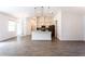 Open-concept design connects the living area, dining space, and modern kitchen with island at 17406 Isaac Ln, Punta Gorda, FL 33955