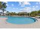 The community pool features plenty of space for swimming and relaxing in the Florida sun at 17418 Holly Well Ave, Wimauma, FL 33598