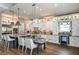 Modern kitchen features a large island, stainless steel appliances, and pendant lighting at 17716 Roost Pl, Lakewood Ranch, FL 34211