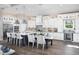 Modern kitchen features a large island, stainless steel appliances, and pendant lighting at 17716 Roost Pl, Lakewood Ranch, FL 34211