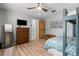 Bedroom with a bunk bed, dresser, TV, and wood floors at 2085 Lynnwood Ct, Dunedin, FL 34698