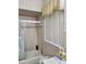Classic bathroom with a shower and tub combination, tiled walls, and natural light at 2222 Harper St, Tampa, FL 33605