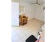 Bedroom with a ceiling fan, tiled flooring, and a window, with a view out to the front yard at 2222 Harper St, Tampa, FL 33605