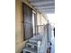 View of house entrance featuring a secure gate, stairway, and light-colored exterior at 2222 Harper St, Tampa, FL 33605