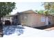 Exterior shot of the property with a carport, neutral walls, and a simple, functional design at 2222 Harper St, Tampa, FL 33605