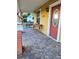 Comfortable front porch with tile flooring and seating, perfect for enjoying the outdoors at 2222 Harper St, Tampa, FL 33605