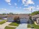 Aerial view showcasing a neighborhood featuring well-maintained lawns, complemented by mature trees and landscaping at 31820 Blythewood Way, Wesley Chapel, FL 33543