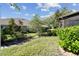 Backyard featuring lush green landscaping and mature trees at 31820 Blythewood Way, Wesley Chapel, FL 33543