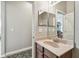 Bathroom featuring vanity with sink, mirror, and wood cabinets at 31820 Blythewood Way, Wesley Chapel, FL 33543