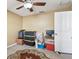 Functional bedroom with a ceiling fan and neutral walls at 31820 Blythewood Way, Wesley Chapel, FL 33543