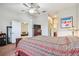 Spacious bedroom with decorative wooden bed frame, and neutral-colored walls at 31820 Blythewood Way, Wesley Chapel, FL 33543