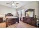 Bedroom featuring ceiling fan, ornate wooden furniture set, and neutral walls at 31820 Blythewood Way, Wesley Chapel, FL 33543