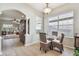 Cozy breakfast nook with tiled floor, natural light, and seamlessly flows into the living area at 31820 Blythewood Way, Wesley Chapel, FL 33543