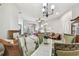 Elegant dining room featuring a chandelier, decorative furnishings, and access to living spaces at 31820 Blythewood Way, Wesley Chapel, FL 33543