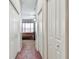Hallway with view into bedroom at 31820 Blythewood Way, Wesley Chapel, FL 33543