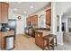 Well-equipped kitchen features stainless steel appliances, tiled floors, and a breakfast bar at 31820 Blythewood Way, Wesley Chapel, FL 33543