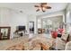 Cozy living room with natural light, ceiling fan, and decorative rug at 31820 Blythewood Way, Wesley Chapel, FL 33543
