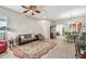 Open-concept living room with tile flooring and large windows for natural light at 31820 Blythewood Way, Wesley Chapel, FL 33543