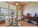 Bright sunroom with natural light, wooden console table, and tiled floors at 31820 Blythewood Way, Wesley Chapel, FL 33543