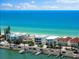 Beautiful view of beachfront homes along the coast, showcasing a pristine beach and clear blue waters at 32 Gulf Blvd, Indian Rocks Beach, FL 33785