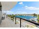 Relax on this spacious balcony and enjoy the beautiful waterfront view and blue sky at 32 Gulf Blvd, Indian Rocks Beach, FL 33785