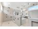 A spa-like bathroom featuring multiple showerheads, a soaking tub, and elegant design elements at 32 Gulf Blvd, Indian Rocks Beach, FL 33785