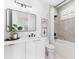 Modern bathroom with sleek vanity, shower/tub combo, and stylish fixtures at 32 Gulf Blvd, Indian Rocks Beach, FL 33785