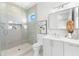 Modern bathroom with glass shower, sleek vanity, and neutral tile design for a luxurious feel at 32 Gulf Blvd, Indian Rocks Beach, FL 33785