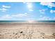 A sunny beach scene with expansive sand and ocean views on a bright, clear day at 32 Gulf Blvd, Indian Rocks Beach, FL 33785