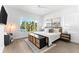 Bright bedroom with a large window and a view of the water at 32 Gulf Blvd, Indian Rocks Beach, FL 33785