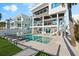 Luxury three-story house featuring a private pool and outdoor seating area at 32 Gulf Blvd, Indian Rocks Beach, FL 33785