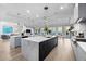 Modern kitchen with marble countertop islands, ocean view, and stainless steel appliances at 32 Gulf Blvd, Indian Rocks Beach, FL 33785